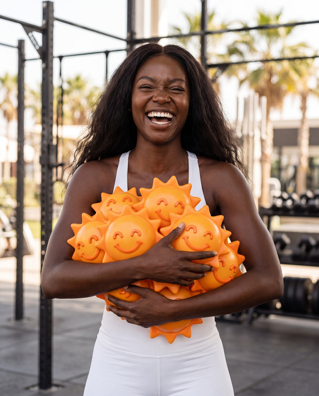 Rékov fan smiling with the orange mascot after a workout